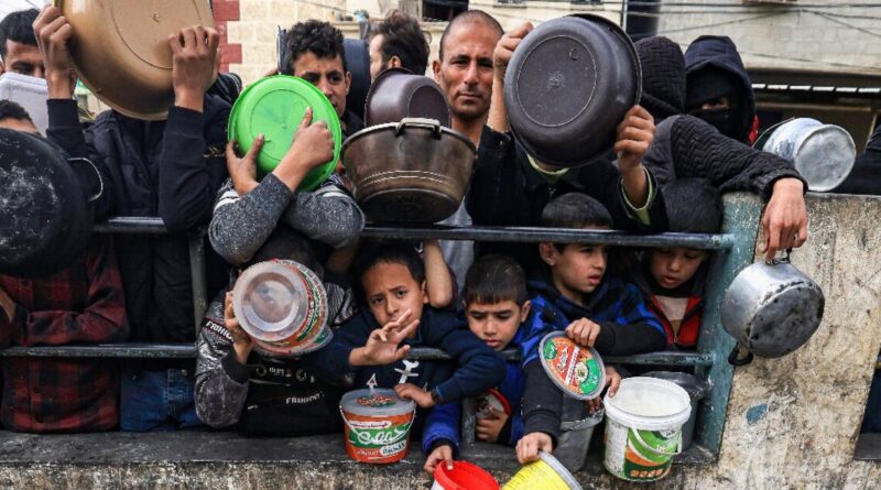 Gripped by hunger, Gazans queue for meagre food