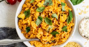 Not your average bowl of orzo pasta -- this one is made with bursting cherry tomatoes and whipped cottage cheese!