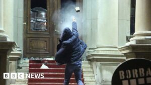 Watch: Demonstrators throw rocks at Belgrade City Hall