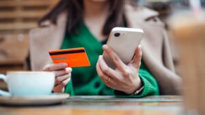 56 million Americans have been in credit card debt for at least a year. 'We are seeing pockets of trouble,' expert says