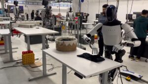 Elon's Tesla robot is sort of 'ok' at folding laundry in pre-scripted demo | TechCrunch