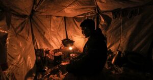 Freezing in makeshift tents, Gazans burn plastic to survive