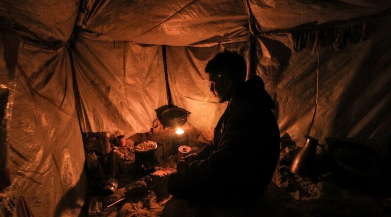 Freezing in makeshift tents, Gazans burn plastic to survive