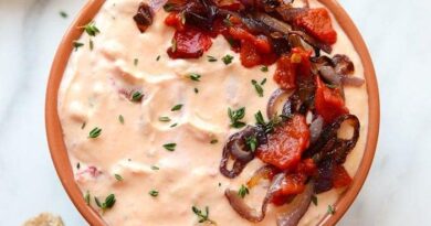 a skinny roasted red pepper and goat cheese dip with bread.