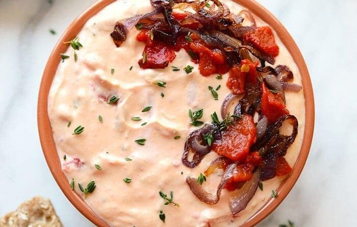 a skinny roasted red pepper and goat cheese dip with bread.