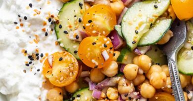 A bowl of chickpeas, cucumbers and yoghurt.