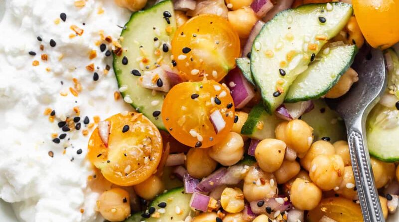 A bowl of chickpeas, cucumbers and yoghurt.