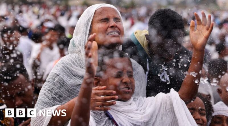 Timket: Ethiopians leap into pool during holy festival