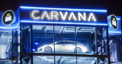 Carvana posts first-ever annual profit after it cuts debt, shares surge