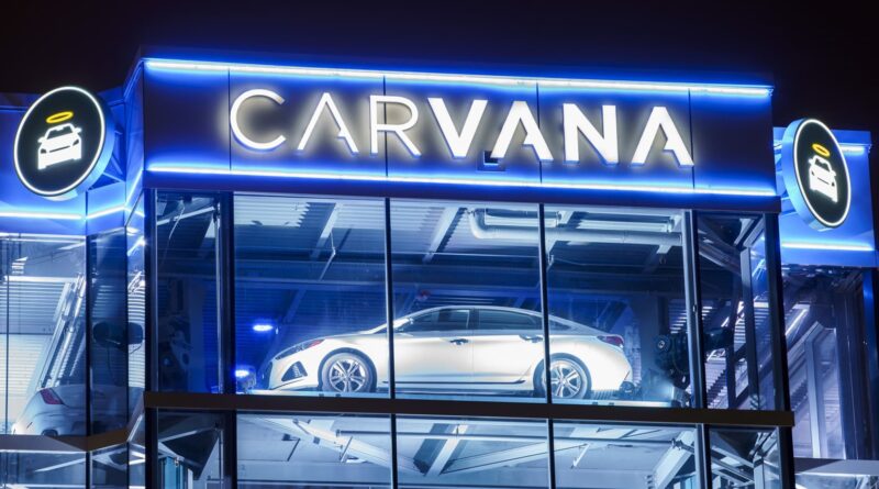 Carvana posts first-ever annual profit after it cuts debt, shares surge