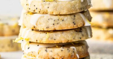 Lemon poppy seed cookies with icing and sprinkles.