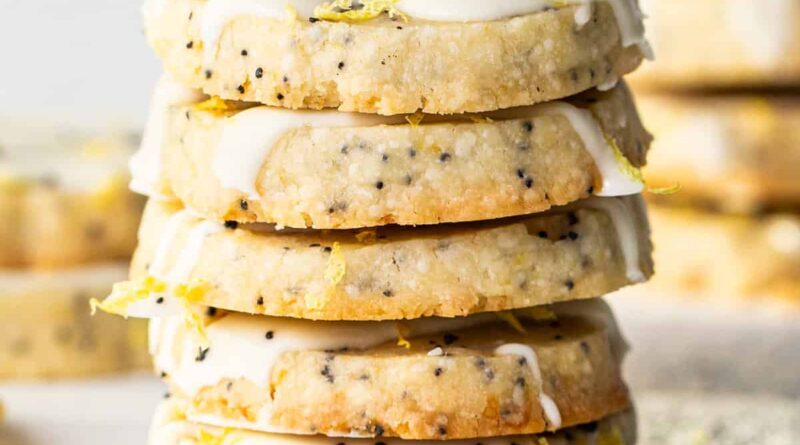 Lemon poppy seed cookies with icing and sprinkles.