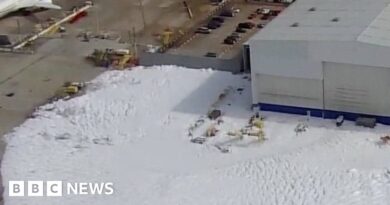 Sea of foam floods Houston airport hangar