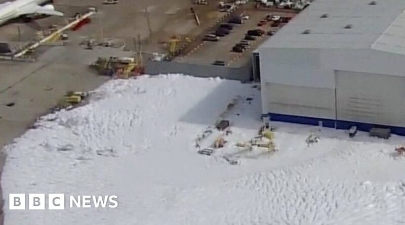 Sea of foam floods Houston airport hangar