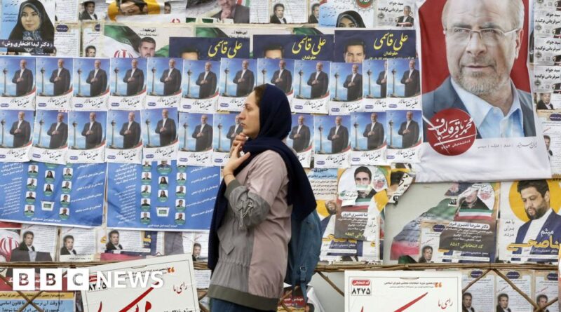 Iran elections: Record low turnout in polls as hardliners win