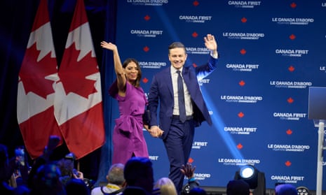 CANADA-VOTE-POLITICSCanada's Conservative leader Pierre Poilievre (R) and his wife Anaida wave to the crowd at the Conservative election party at the Rogers Centre in Ottawa, Ontario on April 28, 2025. Prime Minister Mark Carney won Canada's election on April 28, 2025, leading his Liberal Party to a new term in power after convincing voters his experience managing crises had prepared him to confront US President Donald Trump. (Photo by Geoff Robins / AFP) (Photo by GEOFF ROBINS/AFP via Getty Images)