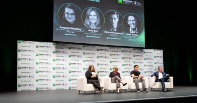 Four people sit on a panel with a title card above that says "how corporations can be better citizens"