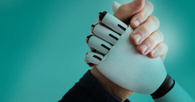human hand an robot hand clasped for arm wrestling