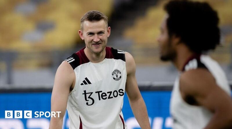 Manchester United defender Matthijs de Ligt smiles at Dutch team-mate Joshua Zirkzee during the post-season trip to Asia