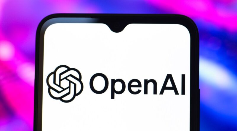The OpenAI logo is seen displayed on a smartphone screen.