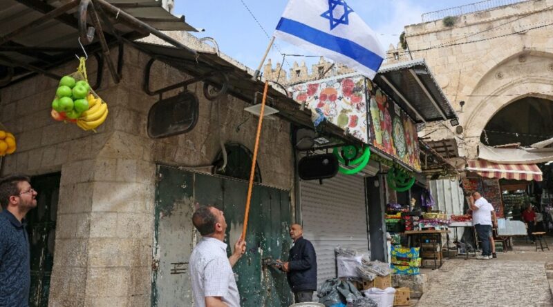 Palestinians clean up after Israeli nationalist march in Jerusalem