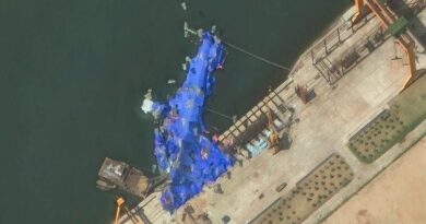 Satellite images show the catastrophic damage to North Korea's new destroyer that's lying on its side