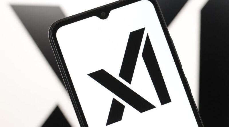 The xAI logo displayed on a smartphone screen.