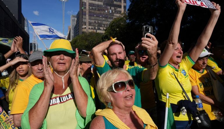 People gather in support of former Brazilian President Jair Bolsonaro, ahead of his trial in the Supreme Federal Court, in Paulista Avenue, Sao Paulo,