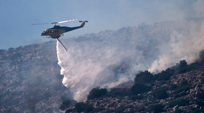 Greece battles wildfire near capital as summer’s first heatwave hits