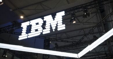 an IBM logo lit up on a dark background