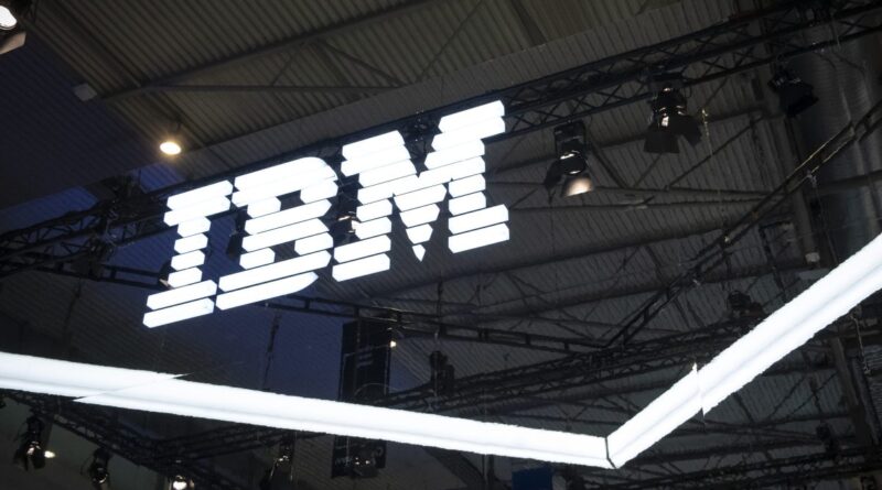 an IBM logo lit up on a dark background