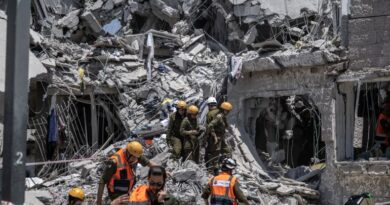 Israeli search and rescue team conduct operation amid the rubble of destroyed building after the attacks of Iranian army following the launch of large-scale Israeli strikes against Iran in Rishon LeZion, Israel on June 14, 2025. [Mostafa Alkharouf/Anadolu Agency]
