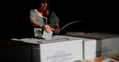 A woman casts her ballots on referendums on citizenship and job protections, at a polling station in Rome, Sunday, June 8, 2025. [Cecilia Fabiano/LaPresse via AP]