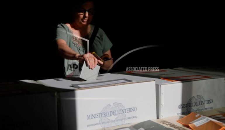 A woman casts her ballots on referendums on citizenship and job protections, at a polling station in Rome, Sunday, June 8, 2025. [Cecilia Fabiano/LaPresse via AP]