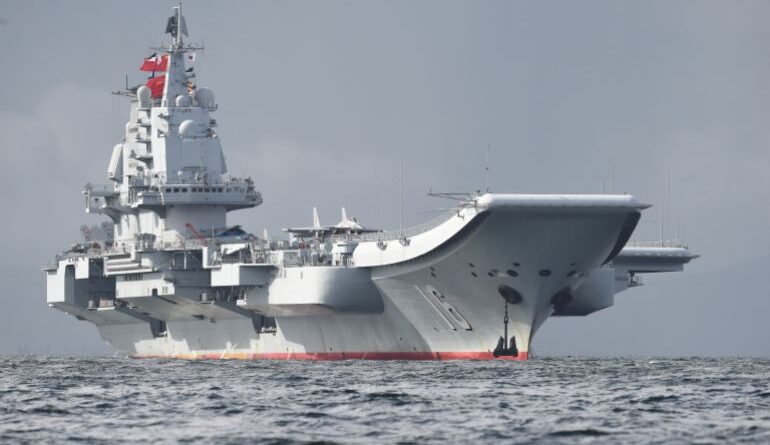China's sole aircraft carrier, the Liaoning, arrives in Hong Kong waters on July 7, 2017, less than a week after a high-profile visit by president Xi Jinping. China's national defence ministry had said the Liaoning, named after a northeastern Chinese province, was part of a flotilla on a "routine training mission" and would make a port of call in the former British colony. (Photo by Anthony WALLACE / AFP)