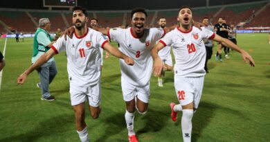 Jordan's players Abdallah Nasib, Yazan Al-Naimat, and Muhannad Abu Taha run after the 2026 FIFA World Cup qualifying match between Oman
