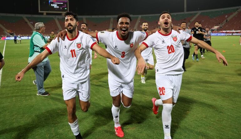 Jordan's players Abdallah Nasib, Yazan Al-Naimat, and Muhannad Abu Taha run after the 2026 FIFA World Cup qualifying match between Oman