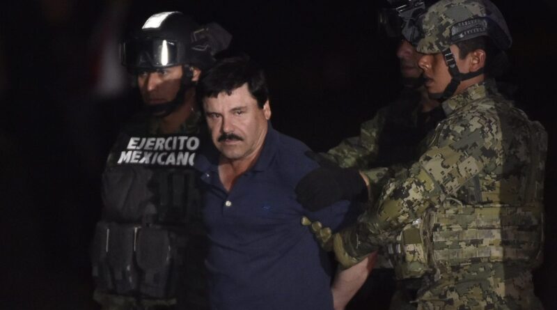 Drug kingpin Joaquin "El Chapo" Guzman is escorted by marines to a helicopter at Mexico City's airport on January 8, 2016 following his recapture during an intense military operation in Los Mochis, in Sinaloa State.
