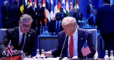 Britain's Prime Minister Keir Starmer and US President Donald Trump attend a meeting of the North Atlantic Council (NAC) during a NATO summit in The Hague, Netherlands June 25, 2025. [Toby Melville/Reuters]