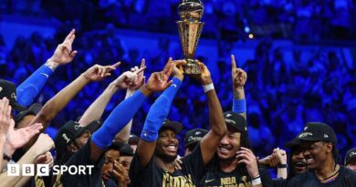 Shai Gilgeous-Alexander and the Oklahoma City Thunder with the NBA Trophy