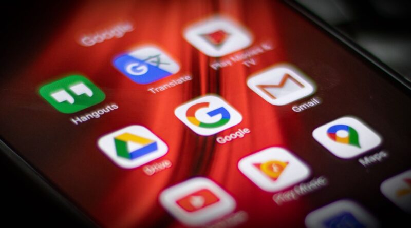 A picture of a smartphone and some apps' icons.