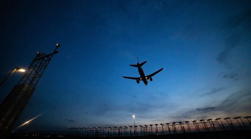 plan flying at dusk