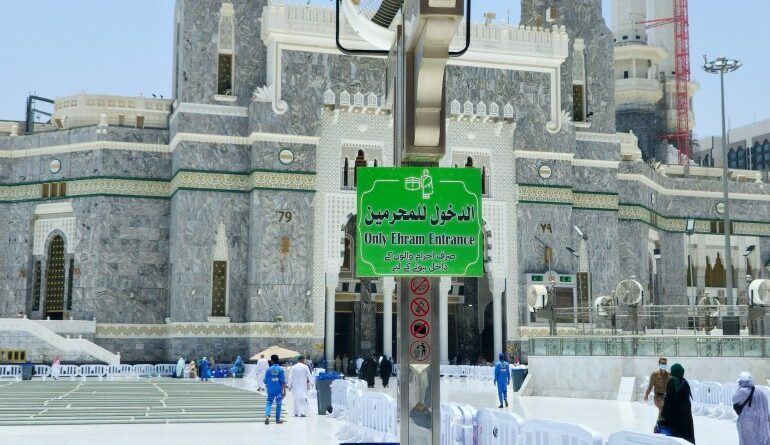 Mecca, Saudi Arabia, June 7 2024: Entry is for Umrah pilgrims in Ihram clothing only sign board in the grand mosque of Makkah, the sacred mosque, before entry of the area around the Kaaba