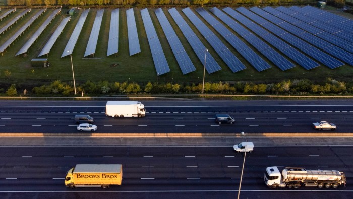 solar panels at the Cranham Golf Course PV Plant near the M25 motorway in Cranham, UK