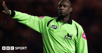 Uriah Rennie refereeing in the Premier League
