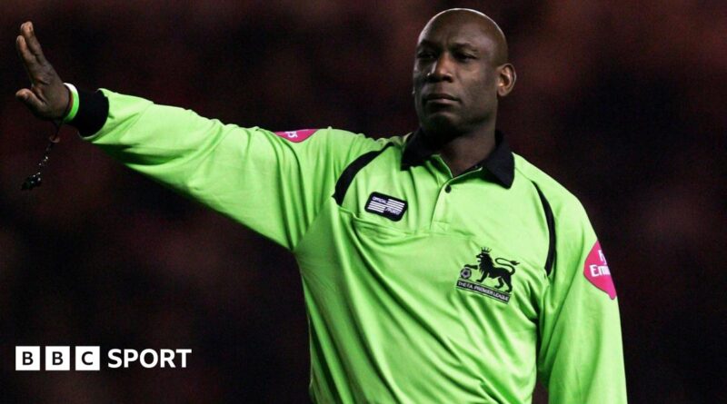 Uriah Rennie refereeing in the Premier League