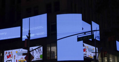 Times Square billboards displaying Windows blue screen of death after CrowdStrike outage on July 19, 2024.