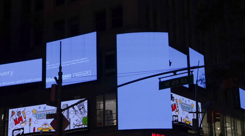Times Square billboards displaying Windows blue screen of death after CrowdStrike outage on July 19, 2024.