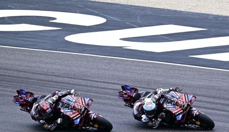 Francesco Bagnaia and Marc Marquez in action.