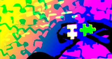 hands holding jigsaw pieces, colorful abstract background